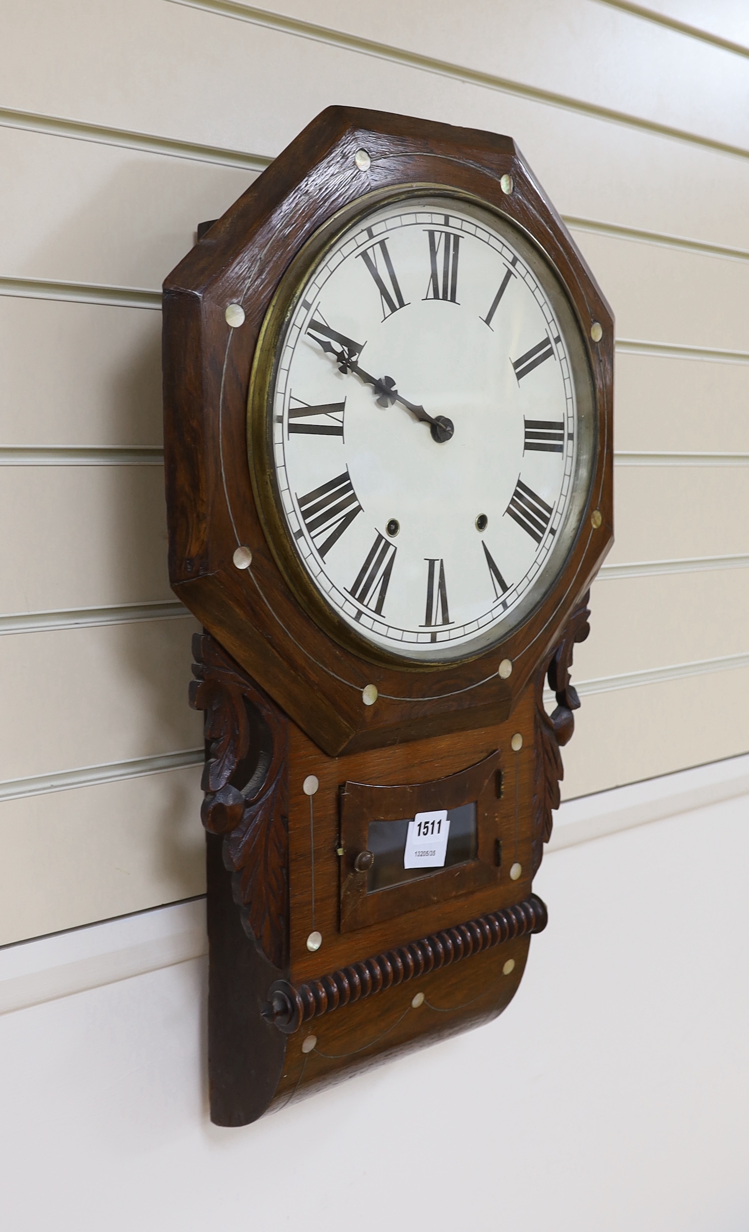 A 19th century American rosewood wall clock with abalone inlay, 67cm high